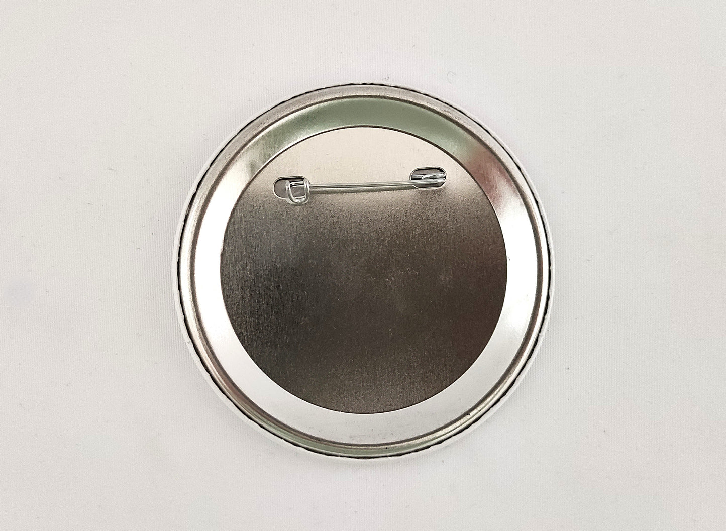 Broche "On vous regarde"